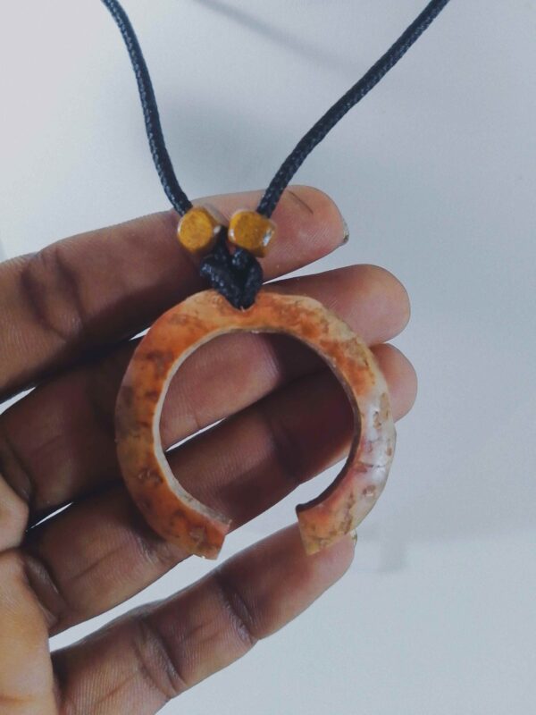 handmade circular coconut shell pendant